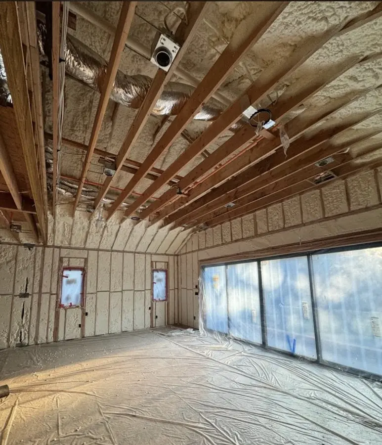 Interior walls and ceiling insulated with spray foam during new construction in Millville